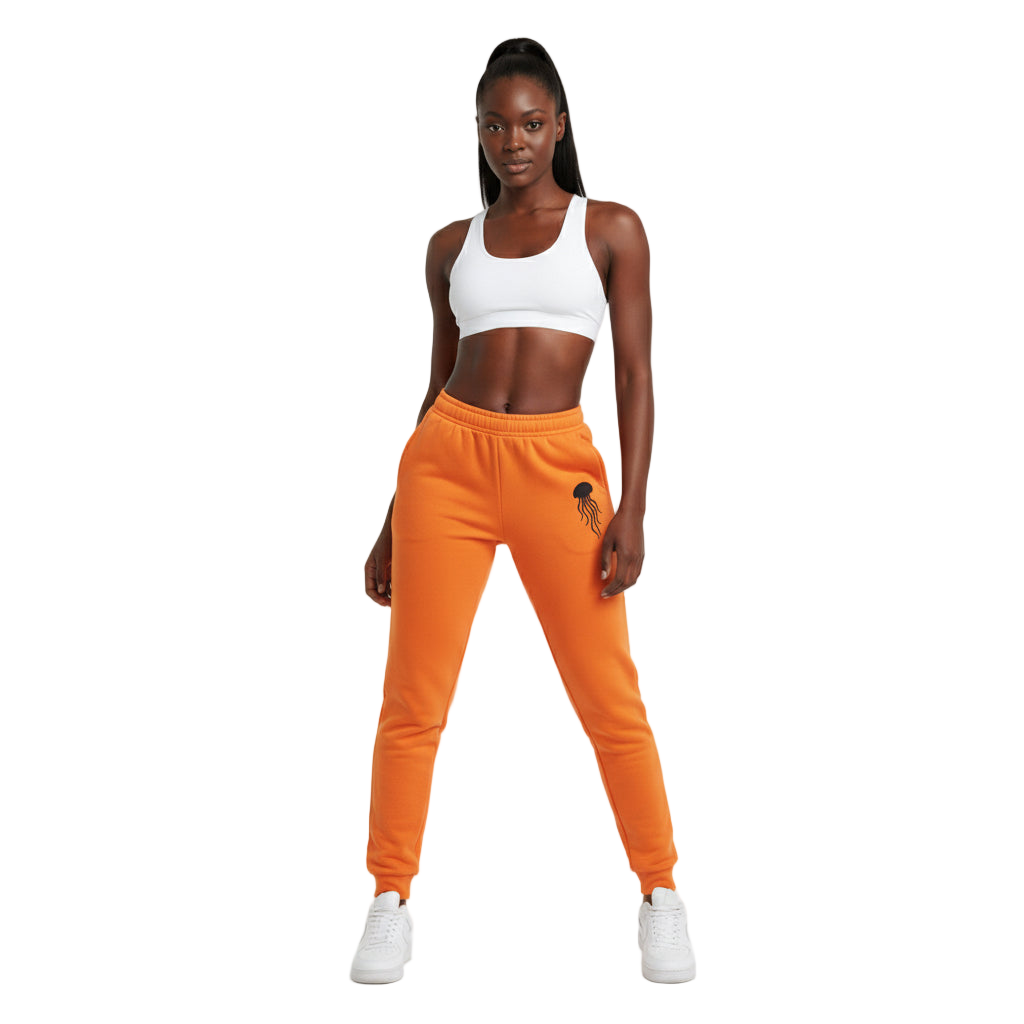 Woman wearing an orange tracksuit with a white background