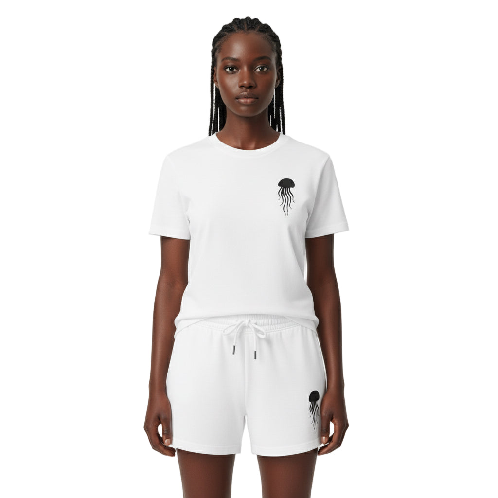 Person wearing a white t-shirt and shorts set with a jellyfish design on a white background