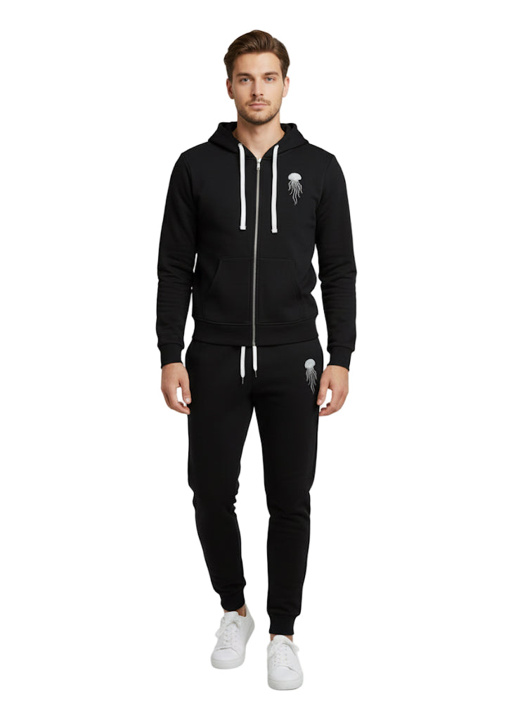 A man wearing black zip-up hoodie and jogger with white jellyfish logo on it.