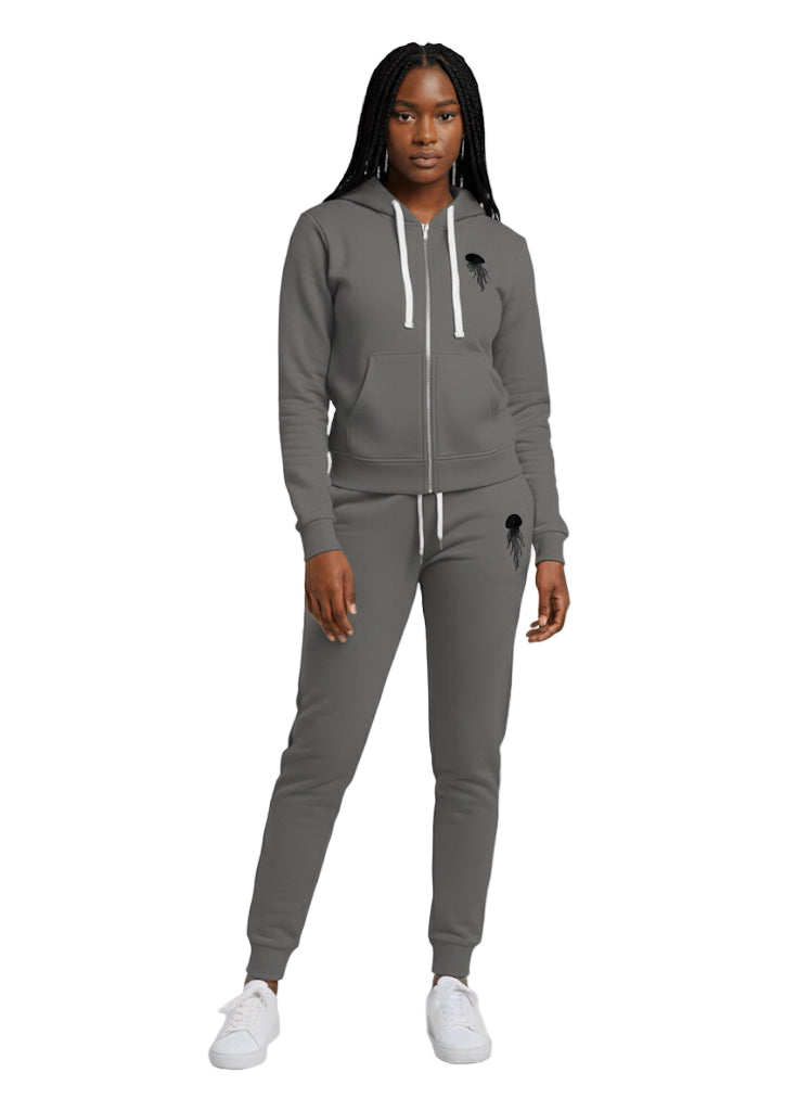 A woman wearing a stratosphere zip-up hoodie and jogger set with jellyfish logo in black color 