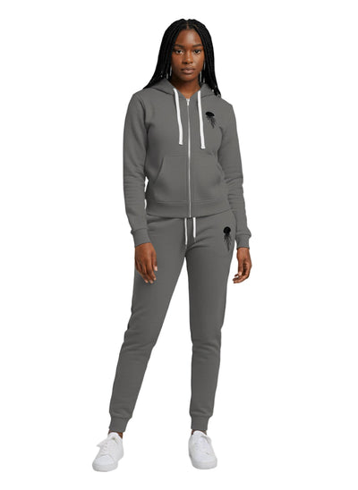 A woman wearing a stratosphere zip-up hoodie and jogger set with jellyfish logo in black color 