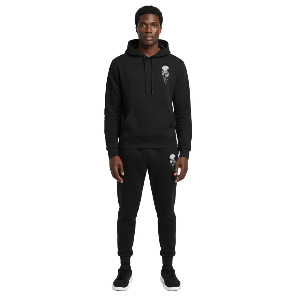A man wearing a black hoodie and pants with a jellyfish logo on a white background